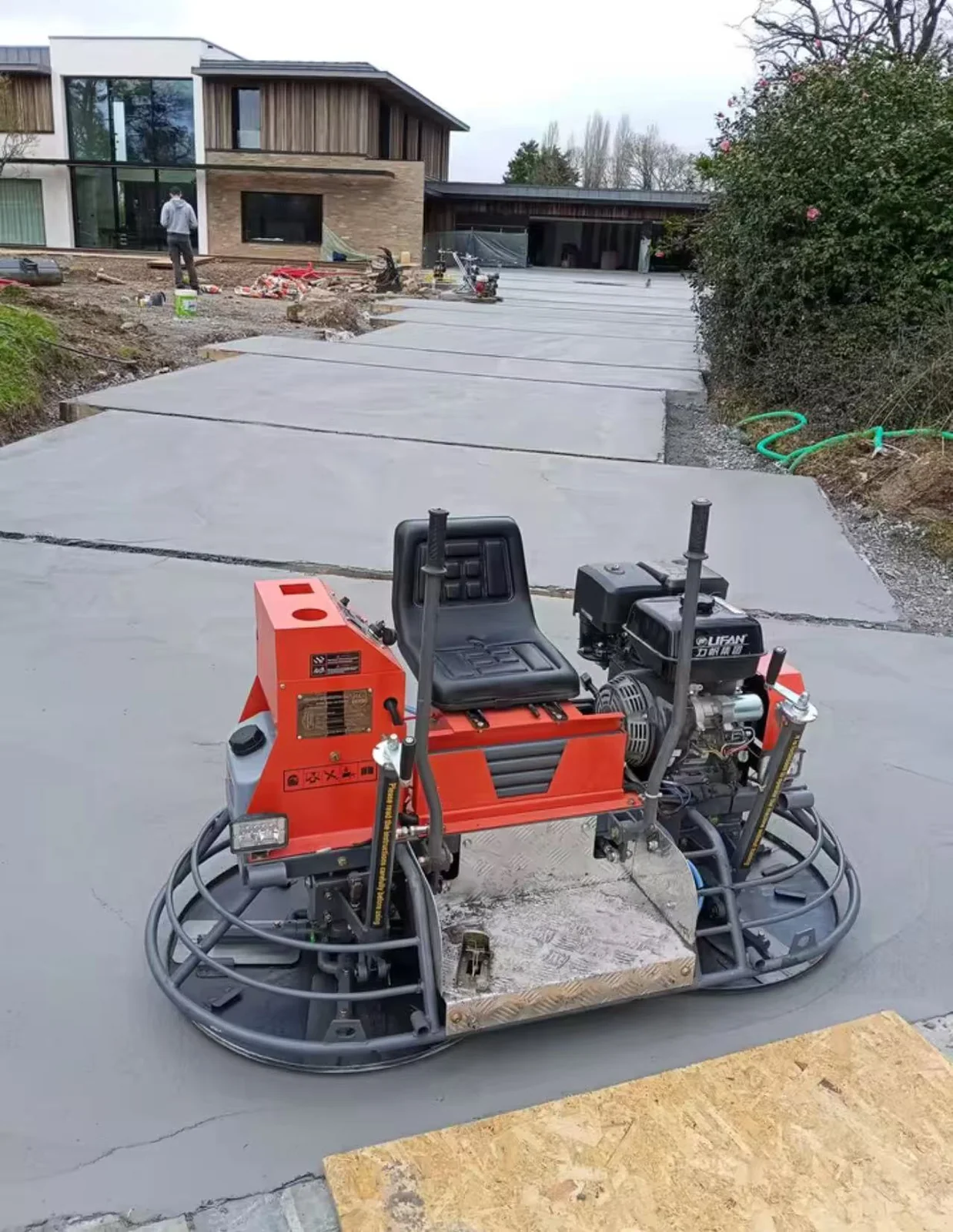 Buyer photograph: ride-on trowel on site